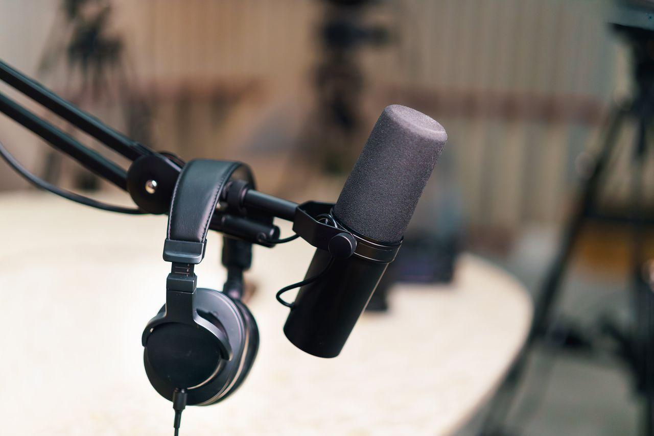 Microphone and headphones in a recording studio